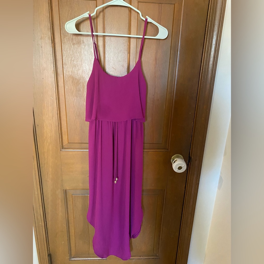 Magenta colored spaghetti strap dress with front tie, gold accents on tie